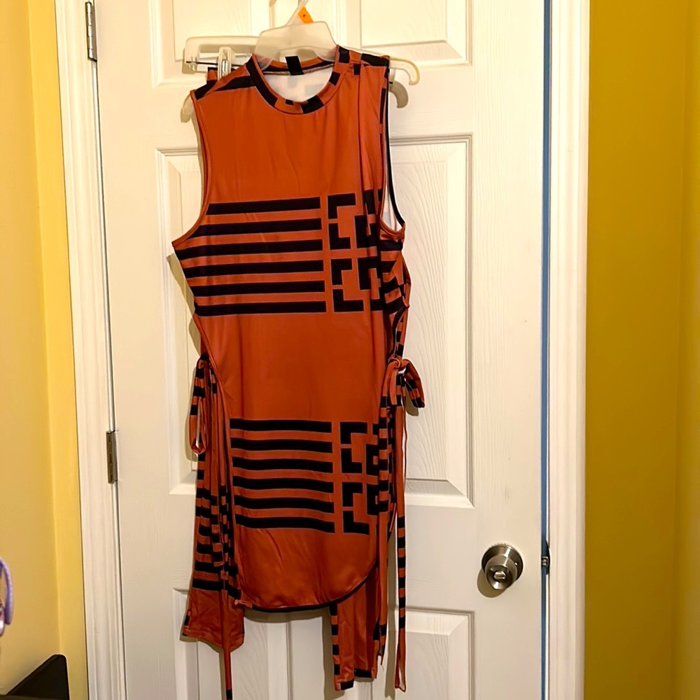 Beautiful Burnt orange and black pant suit. Worn one time.